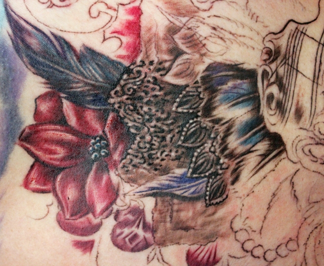Masquerade Chest Tattoo done by Sean Ambrose at Arrows and Embers Custom 